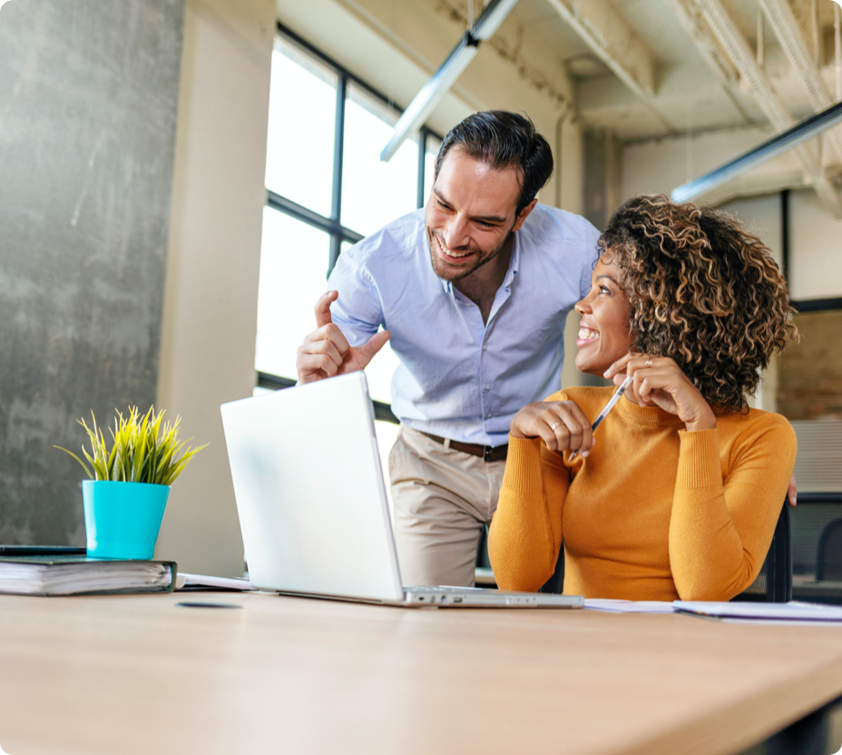 Trainer teaching employee how to perform task