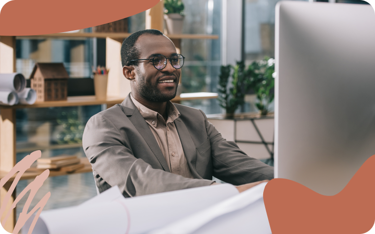Man Working Happily at Computer