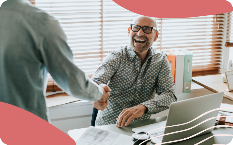 Man succeeding at work shaking hands