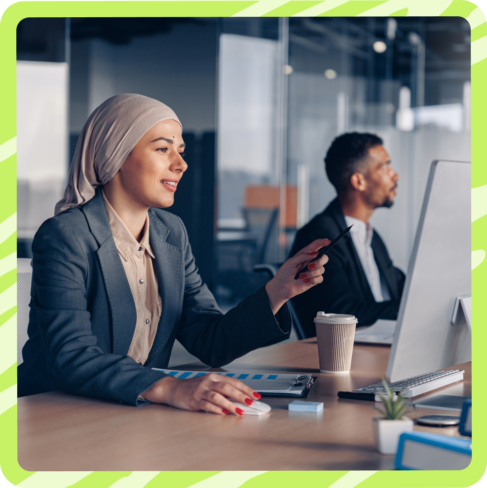 Woman happily working on computer
