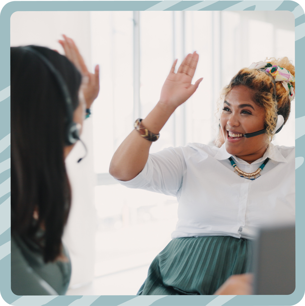 Happy call center agents high-fiving